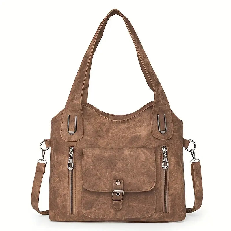 Emilia’s spacious retro-style shoulder bag