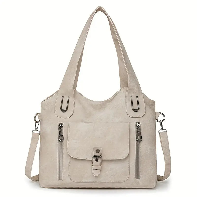 Emilia’s spacious retro-style shoulder bag