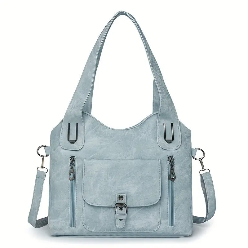 Emilia’s spacious retro-style shoulder bag